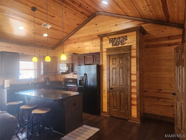 2085 Robinson Pond Rd, Prattville, AL 36067 - kitchen with wood ceiling, wooden walls, black appliances, and vaulted ceiling
