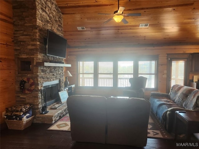 2085 Robinson Pond Rd, Prattville, AL 36067 - living area with visible vents, wood walls, a fireplace, and ceiling fan