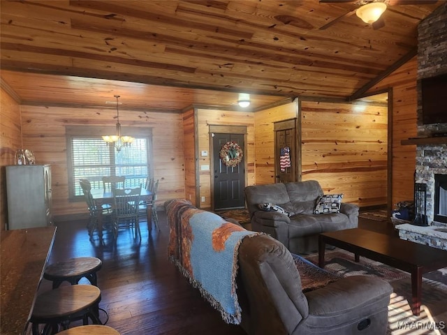 2085 Robinson Pond Rd, Prattville, AL 36067 - living area featuring a stone fireplace, wood ceiling, wood walls, wood-type flooring, and ceiling fan with notable chandelier