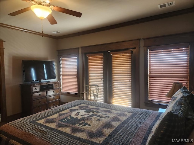 2085 Robinson Pond Rd, Prattville, AL 36067 - bedroom with crown molding, a ceiling fan, and visible vents