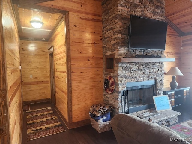 2085 Robinson Pond Rd, Prattville, AL 36067 - living room with wood walls, wood ceiling, lofted ceiling, a stone fireplace, and wood finished floors
