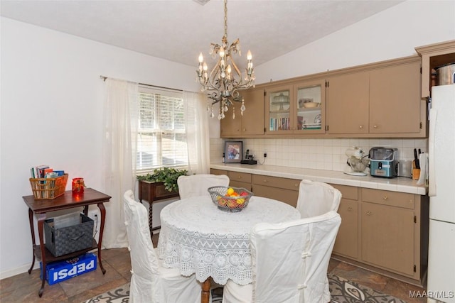 100 Royal Dr, Equality, AL 36026 - dining space featuring lofted ceiling and an inviting chandelier