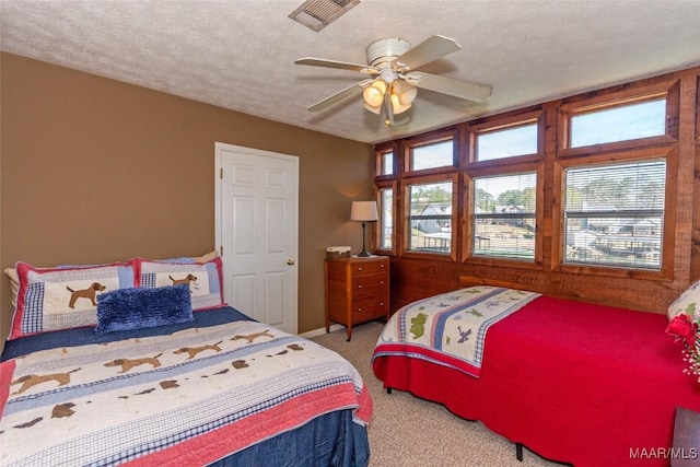100 Royal Dr, Equality, AL 36026 - carpeted bedroom with ceiling fan, visible vents, and a textured ceiling