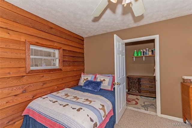 100 Royal Dr, Equality, AL 36026 - carpeted bedroom with baseboards, a textured ceiling, and a ceiling fan