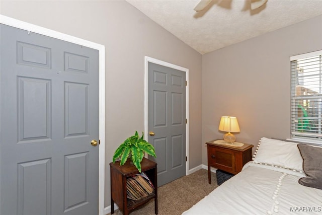 100 Royal Dr, Equality, AL 36026 - carpeted bedroom with vaulted ceiling, a ceiling fan, baseboards, and a textured ceiling