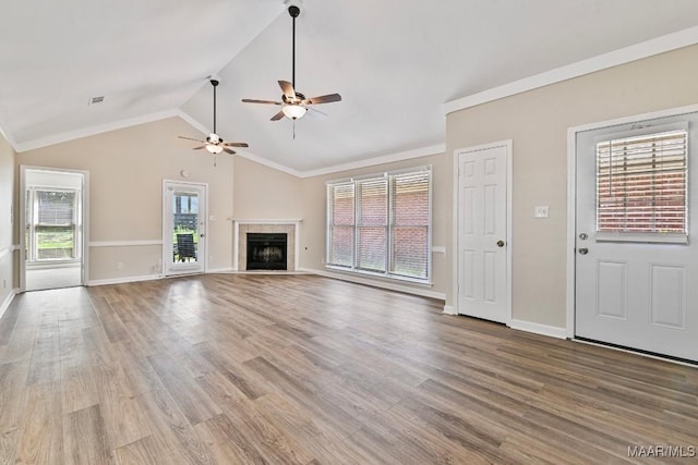 6528 Enfield Mews, Montgomery, AL 36117 - unfurnished living room with wood finished floors, a ceiling fan, baseboards, a fireplace, and vaulted ceiling