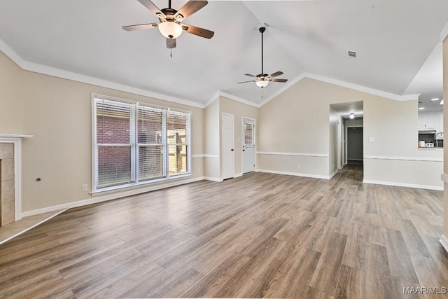 6528 Enfield Mews, Montgomery, AL 36117 - unfurnished living room featuring baseboards, ceiling fan, vaulted ceiling, light wood-style floors, and crown molding
