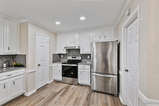 6528 Enfield Mews, Montgomery, AL 36117 - kitchen with dark stone counters, stainless steel appliances, light wood-style floors, under cabinet range hood, and white cabinetry