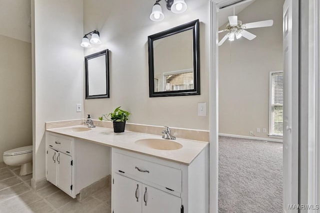 6528 Enfield Mews, Montgomery, AL 36117 - bathroom with double vanity, toilet, ceiling fan, and a sink