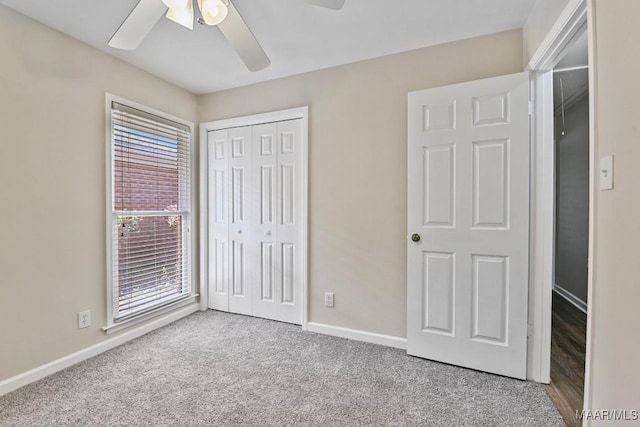 6528 Enfield Mews, Montgomery, AL 36117 - unfurnished bedroom with a closet, carpet flooring, a ceiling fan, and baseboards