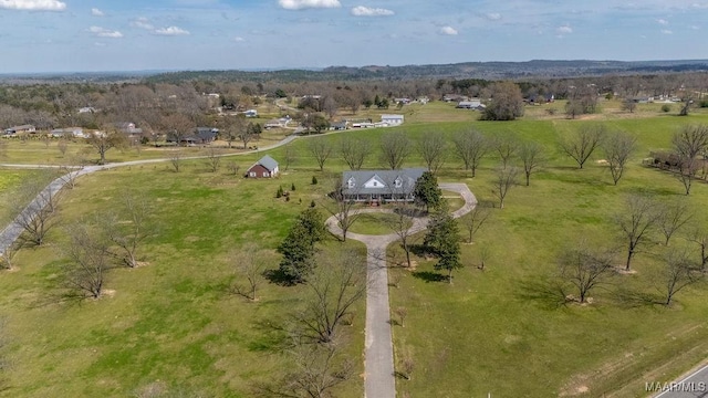 birds eye view of property with a rural view