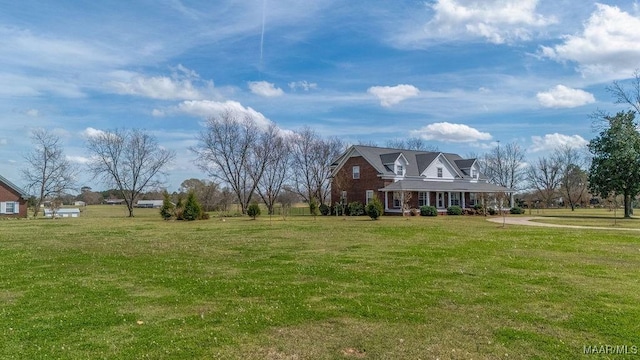 view of front of house featuring a porch and a front lawn
