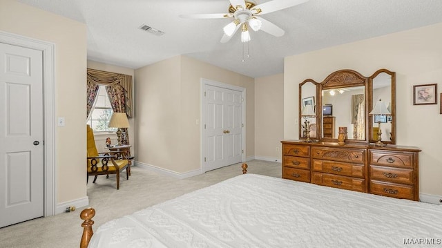 bedroom featuring visible vents, baseboards, carpet, and ceiling fan