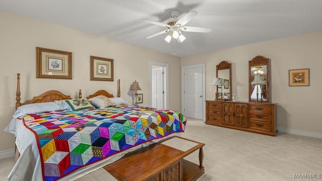 bedroom with light carpet, a textured ceiling, and a ceiling fan