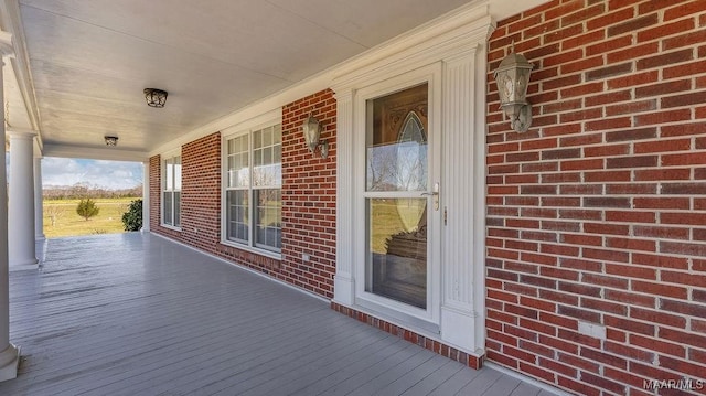 wooden deck featuring covered porch