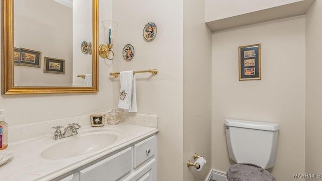 half bath with vanity and toilet