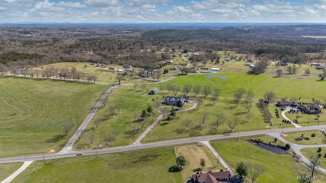 birds eye view of property featuring a rural view
