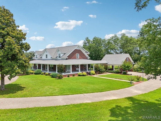 13650 County Road 29th Rd, Clanton, AL 35045 - country-style home featuring a porch, a front lawn, and driveway