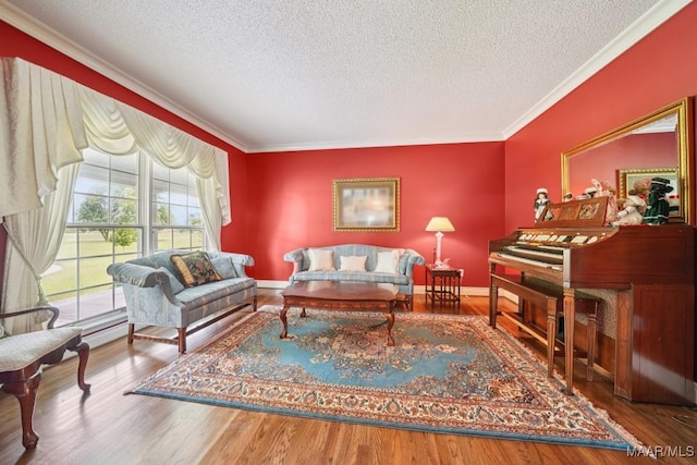13650 County Road 29th Rd, Clanton, AL 35045 - living room featuring a textured ceiling, ornamental molding, and wood finished floors