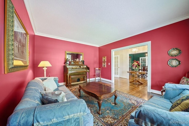 13650 County Road 29th Rd, Clanton, AL 35045 - living room with ornamental molding, wood finished floors, french doors, and a textured ceiling