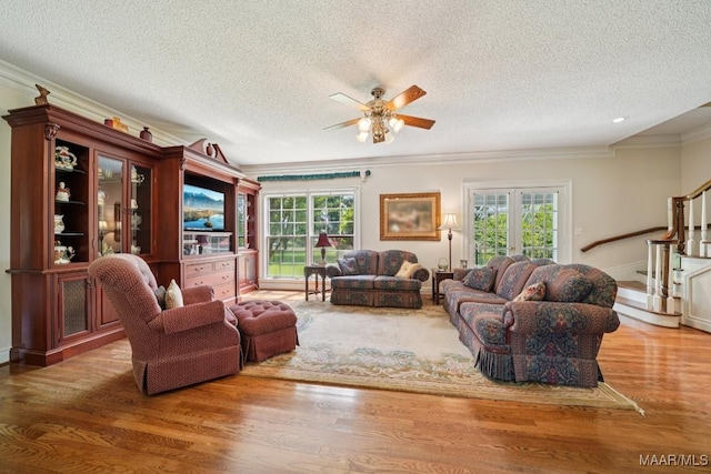 13650 County Road 29th Rd, Clanton, AL 35045 - living area with crown molding, wood finished floors, ceiling fan, stairs, and a textured ceiling