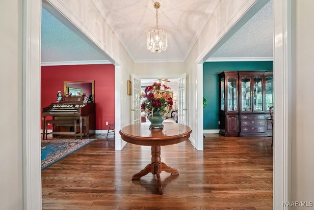 13650 County Road 29th Rd, Clanton, AL 35045 - foyer entrance featuring a chandelier, wood finished floors, and crown molding