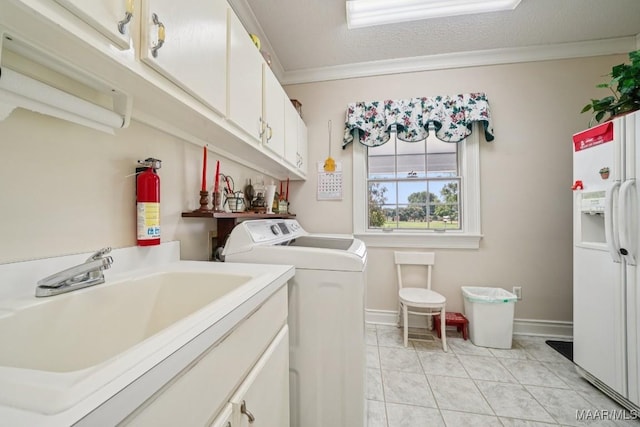 13650 County Road 29th Rd, Clanton, AL 35045 - laundry room with separate washer and dryer, cabinet space, and light tile patterned flooring