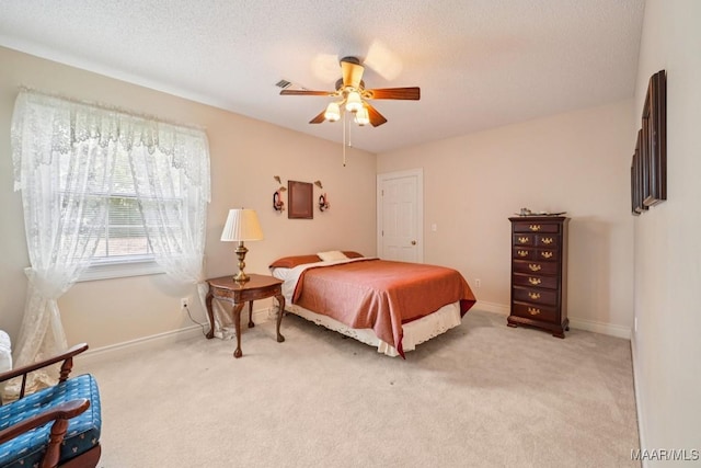 13650 County Road 29th Rd, Clanton, AL 35045 - bedroom with light colored carpet, ceiling fan, and a textured ceiling