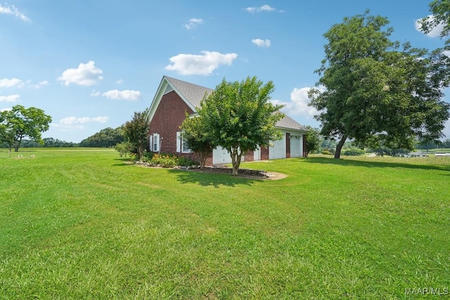 13650 County Road 29th Rd, Clanton, AL 35045 - view of property exterior featuring brick siding, a yard, and an attached garage