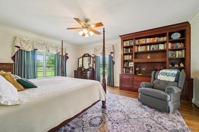 13650 County Road 29th Rd, Clanton, AL 35045 - bedroom featuring crown molding, wood finished floors, and a textured ceiling