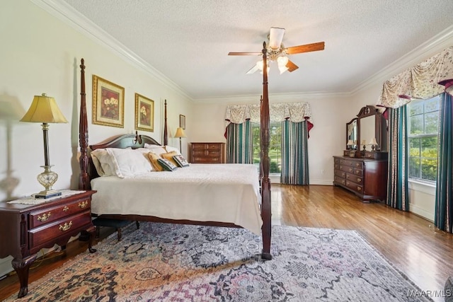 13650 County Road 29th Rd, Clanton, AL 35045 - bedroom featuring wood finished floors, crown molding, a textured ceiling, and a ceiling fan