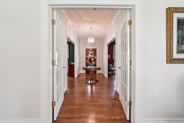 13650 County Road 29th Rd, Clanton, AL 35045 - hallway with wood finished floors, a chandelier, and crown molding