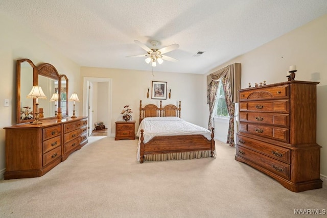 13650 County Road 29th Rd, Clanton, AL 35045 - bedroom featuring light colored carpet, a textured ceiling, and ceiling fan
