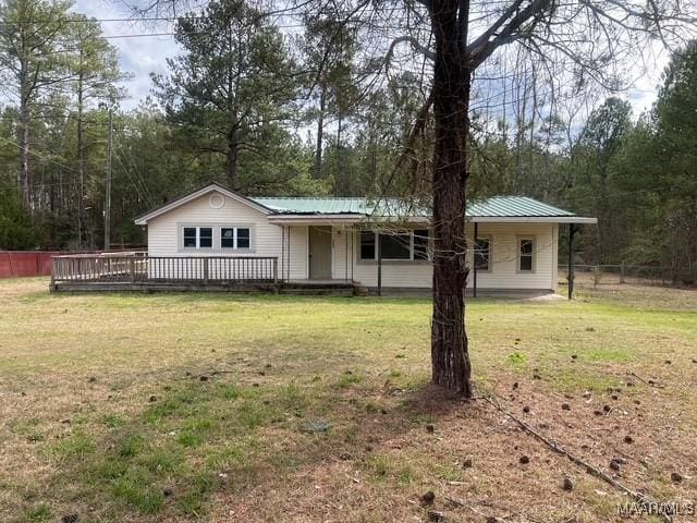 2343 Friendship Rd, Tallassee, AL 36078 - view of front of home featuring metal roof, a front yard, and fence