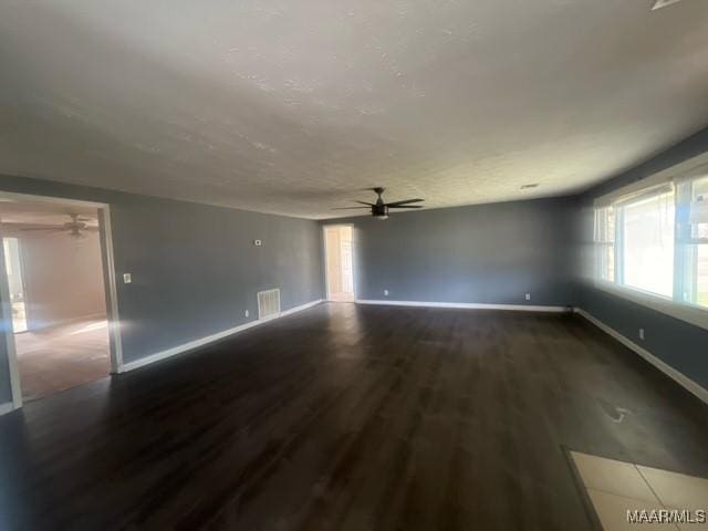 2343 Friendship Rd, Tallassee, AL 36078 - spare room featuring visible vents, a textured ceiling, wood finished floors, baseboards, and ceiling fan