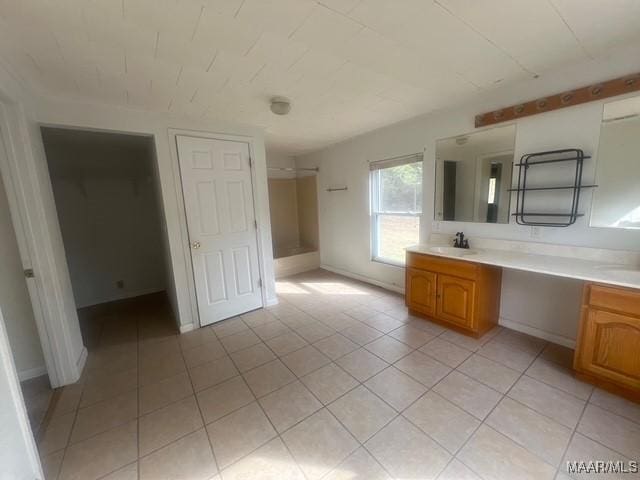 2343 Friendship Rd, Tallassee, AL 36078 - full bathroom with double vanity, a shower, tile patterned floors, and a sink