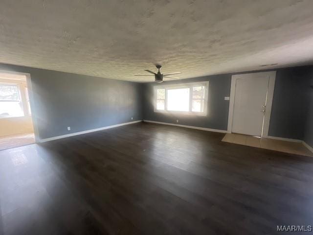 2343 Friendship Rd, Tallassee, AL 36078 - spare room featuring dark wood-style floors, baseboards, and ceiling fan