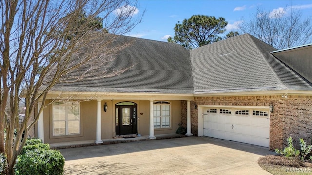 1605 Guiding Way Ln, Prattville, AL 36067 - view of front facade featuring concrete driveway, an attached garage, brick siding, a porch, and roof with shingles