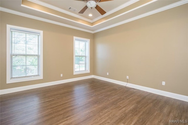 1605 Guiding Way Ln, Prattville, AL 36067 - spare room with a tray ceiling, dark wood finished floors, ceiling fan, ornamental molding, and baseboards