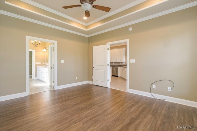 1605 Guiding Way Ln, Prattville, AL 36067 - spare room with a raised ceiling, crown molding, wood finished floors, a chandelier, and ceiling fan