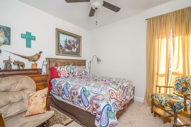 bedroom with baseboards, multiple windows, carpet, and ceiling fan
