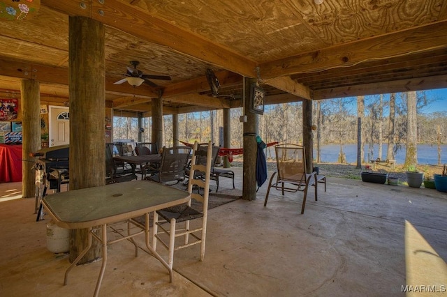 view of patio / terrace with outdoor dining space and a water view