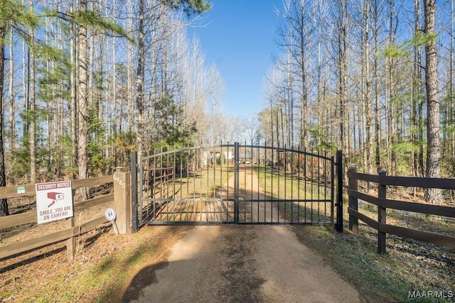 view of gate featuring fence