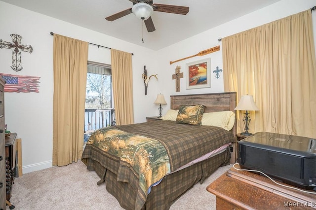 bedroom with a ceiling fan, carpet, and baseboards