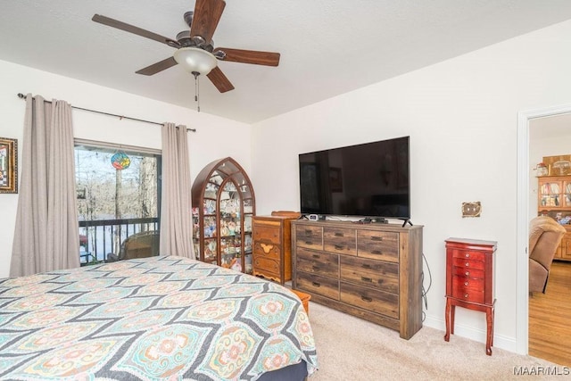 bedroom featuring carpet flooring, baseboards, ceiling fan, and access to outside