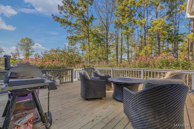 wooden terrace with a grill