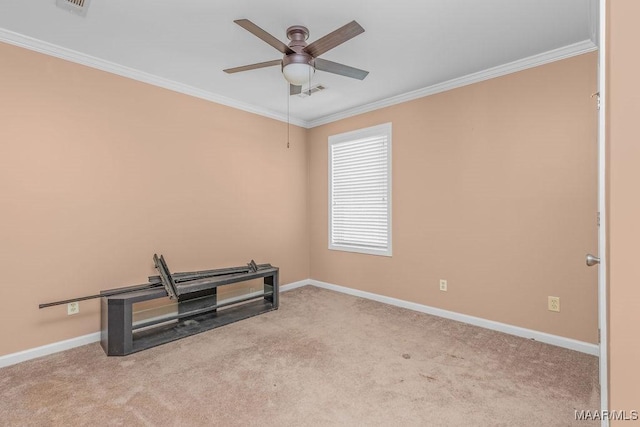 interior space featuring carpet, crown molding, a ceiling fan, and baseboards