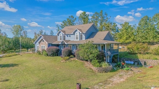 view of front of property with a porch and a front lawn