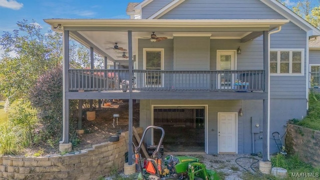 rear view of property with a ceiling fan