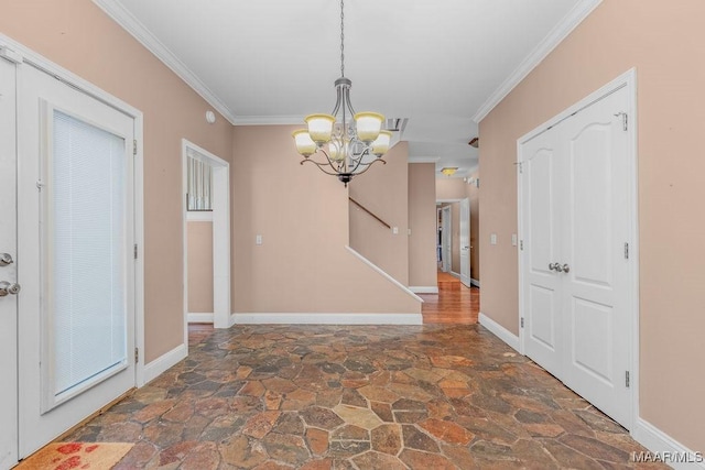 interior space with stone finish floor, baseboards, a chandelier, and ornamental molding